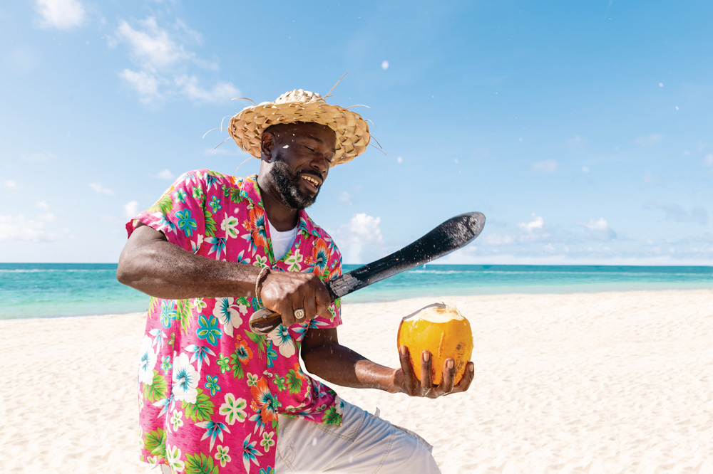 Grand Bahama Tourism Sector - Man offering Tender Coconut